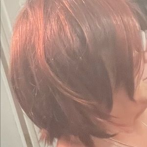 Brown synthetic wig with reddish highlights